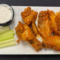 Chicken Wings · Fresh plump chicken wings fried and tossed in your seasoning of choice.