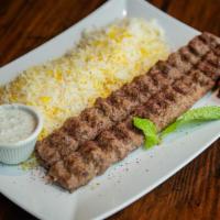 Koobideh · Our special ground beef skewers made with sumac and onions. Served with a rice and cucumber ...