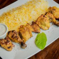 Joojeh · A skewer of lemon marinated cornish hen seasoned with saffron. Served with saffron rice.