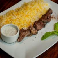 Chenjeh · A skewer of diced lamb marinated in mint yogurt. Served with saffron rice.