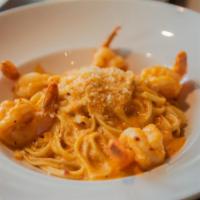 Spicy Shrimp Linguini · Large shrimp mixed with pasta and served in a spicy tomato cream sauce.