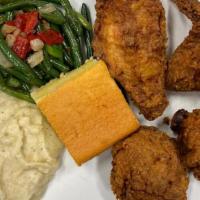 Cajun Fried Chicken · Half a hen of southern fried chicken served with potato puree, green beans and sweet cornbre...