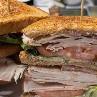 Club Sandwich · Triple-layered oven-roasted turkey or chicken with bacon lettuce, tomato, and mayo