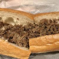 Cheese Steak · Sirloin steak is grilled to perfection, topped with melted American cheese and served on a f...
