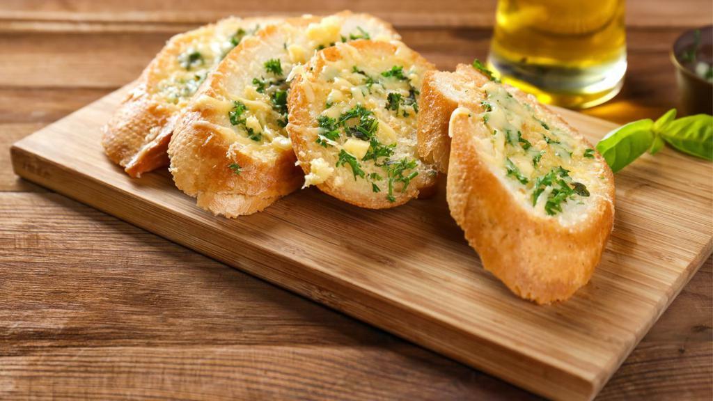 Garlic Bread · Fresh baked bread garnished with garlic.