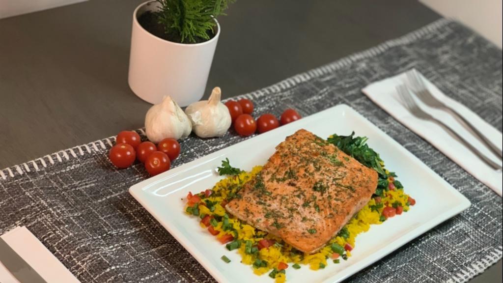 Pan Seared Salmon · Served over chef's yellow rice