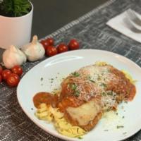 Chicken Parmesan · Breaded chicken breast covered in tomato sauce with mozzarella fresh parmesan.