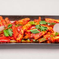Karampodi Paneer · Deep fried paneer cooked in special red chilly sauce with cashew nuts.