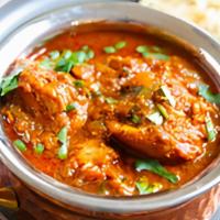 Chicken Vindaloo · Chicken cooked in delicious creamy gravy with potato and coriander