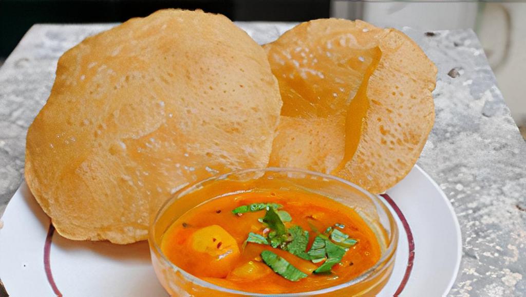 Amitabh Aloo Puri · puffed wheat bread deep fried & served with potato curry