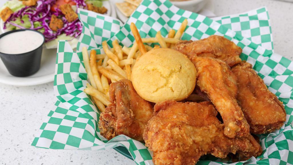 Pop (5) · This is a customer favorite.  5 pieces of pan-fried chicken, served with your choice of side; Hawaiian roll or our freshly baked corn muffin. Served with a breast, thigh, leg, wing, and back.