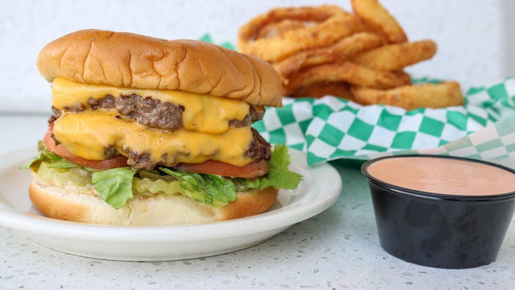 Double Jumbo Cheese · Two 1/4 pound ground beef patties served with double the American cheese, lettuce, tomato, onion, pickle, mayonnaise, and mustard.