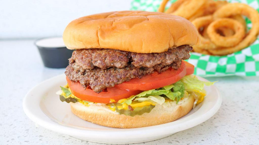 Double Jumbo · Two 1/4 pound ground beef patties served with lettuce, tomato, onion, pickle, mayonnaise, and mustard.