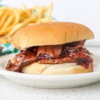 Bbq Pulled Pork Sandwichbeef · Our premium slow cooked pulled pork piled high with BBQ sauce on a bun.