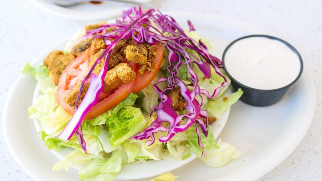 House Salad · A smaller salad made with a blend of iceberg and romaine lettuce, purple cabbage, tomato and our homemade croutons with your choice of dressing.