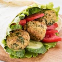 Falafel Wrap · Crispy chickpea fritters wrapped in a pita with lettuce, tomatoes, and onions.