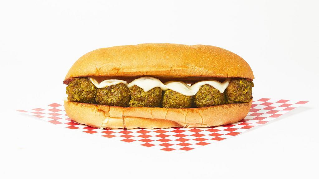The Meatball Pesto Sub · Our house meatballs with fresh basil pesto sauce and melted mozzarella cheese on a hoagie roll.