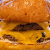 Smash Burger · Potato bun / 2 house blend beef patties / American cheese / mayo