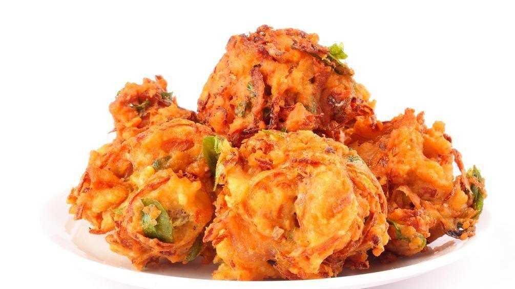 Pakora Vegan , Gluten Free · Mixed vegetable fritters. Served with tamarind and mint sauce.