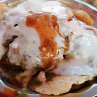 Dahi Vada Papdi Chaat Vegetarian , Contain Gluten & Dairy · Nut free    Fried round balls of Urad lentils soaked overnight in water and crisp wafers ( P...