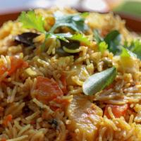 Vegetable Hyderabadi Biryani Vegetarian , Gluten Free , Contain Dairy · Assorted vegetables and long grain basmati rice flavored with exotic spices and saffron. Ser...