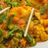 Aloo Gobhi Vegan & Gluten Free · Potatoes and cauliflower cooked in mild spices with tomato and ginger. Served with basmati r...