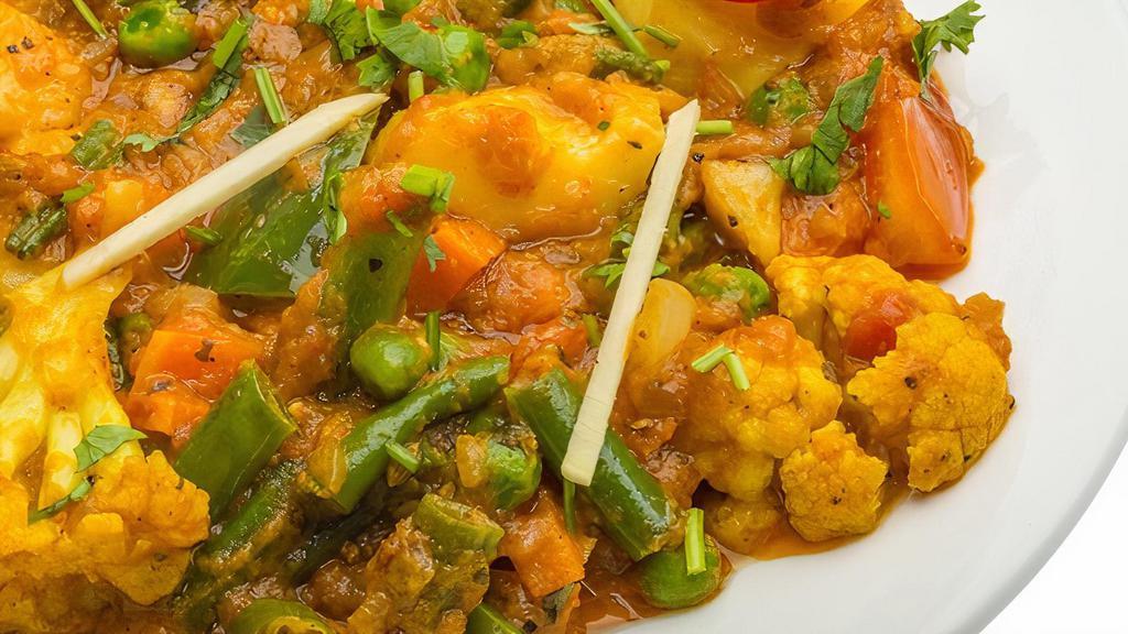 Aloo Gobhi Vegan & Gluten Free · Potatoes and cauliflower cooked in mild spices with tomato and ginger. Served with basmati rice. Gluten free. Nut free. Vegan.