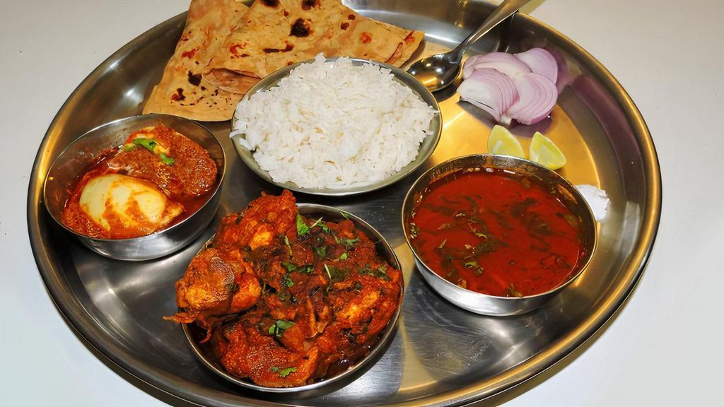 Chicken & Vegetable Combo Platter · Choice of 1 chicken entree and 1 vegetable entree. Served with basmati rice and 2 made-to-order tandoori roti or naan bread.
