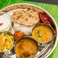 All Vegetable Combo Platter · Choice of any 2 for vegetable entrees. Served with basmati rice and 2 made-to-order tandoori...