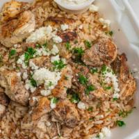 Chicken Gyro Bowl · A bed of Greek rice or mujadara (lettuce and rice) topped with our fresh grilled chicken ten...