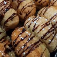 Fried Oreos · Your favorite cookie coated with fluffy funnel cake batter then deep fried to perfection !! ...