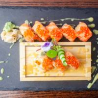 Beauty Alaska Roll · Salmon, crunch and spicy mayo, topped with salmon, ikura and miso yuzu sauce. Raw and spicy.