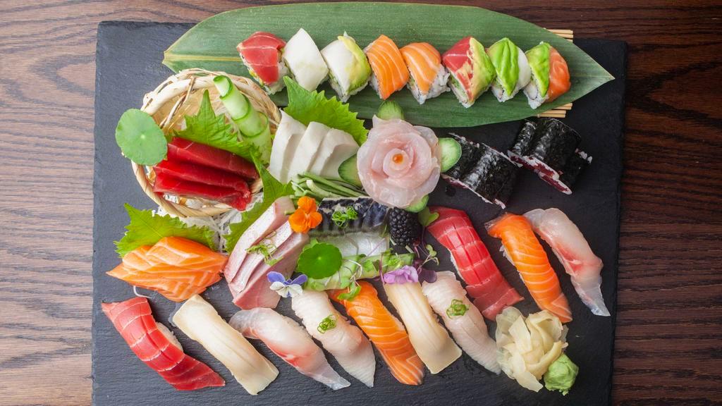 Hakata Supreme · Chef's choice of 10 piece sushi and 18 piece sashimi, served with rainbow roll and tuna maki. Raw.
