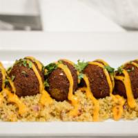 Falafel & Couscous · Chickpea fritters, sriracha-kewpie sauce, cilantro, moroccan spiced date and almond couscous.