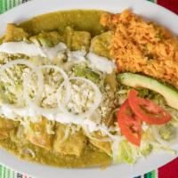 Enchiladas Mexicana · Four stuffed enchiladas covered in green or red salsa, topped with cotija cheese & sour crea...
