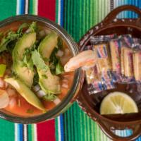 Coctel De Camaron · Fresh shrimp in our special cocktail sauce with avocado, onion, and cilantro. Crackers on th...