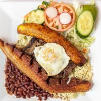 Montañero · Flap meat, pork, fried egg, rice, beans, salad and tortillas.