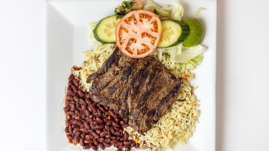 Carne Asada · Flap meat, rice, beans, salad and tortillas.