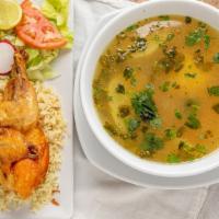 Sopa De Pollo · Chicken soup, rice, salad, and tortillas.