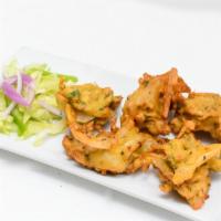 Vegetable Pakora (5 Pcs.) · Fresh vegetable fritters made with spinach, potatoes, onion and cauliflower.