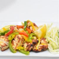 Chicken Tikka · Spicy. Tender pieces of chicken marinated in spices, yogurt and cooked on skewers in tandoor.