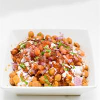Samosa Chat · crispy potato samosas smothered in a chickpeas curry. garnished with yogurt, tamarind and re...