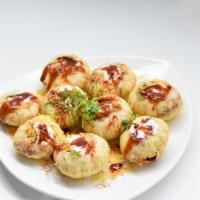 Dahi Puri · Spicy. Semolina puffs filled with spiced chickpeas, potatoes and mint chutney soup.
