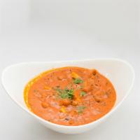 Chana Paneer Masala · Whole chickpeas and homemade cheese with fresh garlic and ginger cooked in creamy tomato sau...