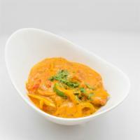 Madrashi Fish · Fresh swordfish cooked in a curry sauce with mushrooms, green peppers and onions.