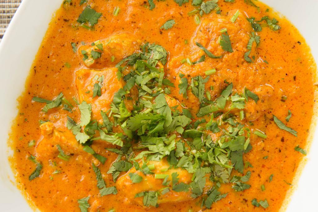 Chicken Curry · Spicy. Boneless chicken cooked in curry sauce with Indian herbs and spices.