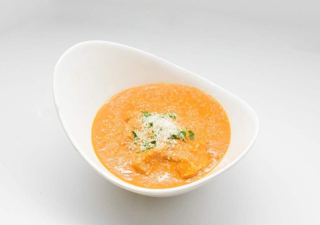 Coconut Chicken Curry · Boneless chicken in curry sauce with mustard seeds and coconut.