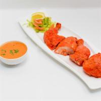 Tandoori Chicken (Half) · Spicy. Tender chicken marinated in yogurt and spices and baked in our tandoor.