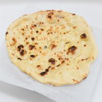 Naan · Unleavened bread baked in a tandoor.