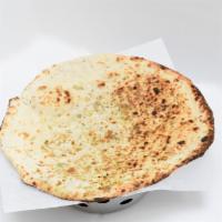 Pista Coconut Naan · Handmade bread stuffed with pistachio and coconut then cooked in our tandoor.